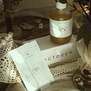 Aesthetic arrangement of luxury cosmetic products with intricate packaging and elegant details.