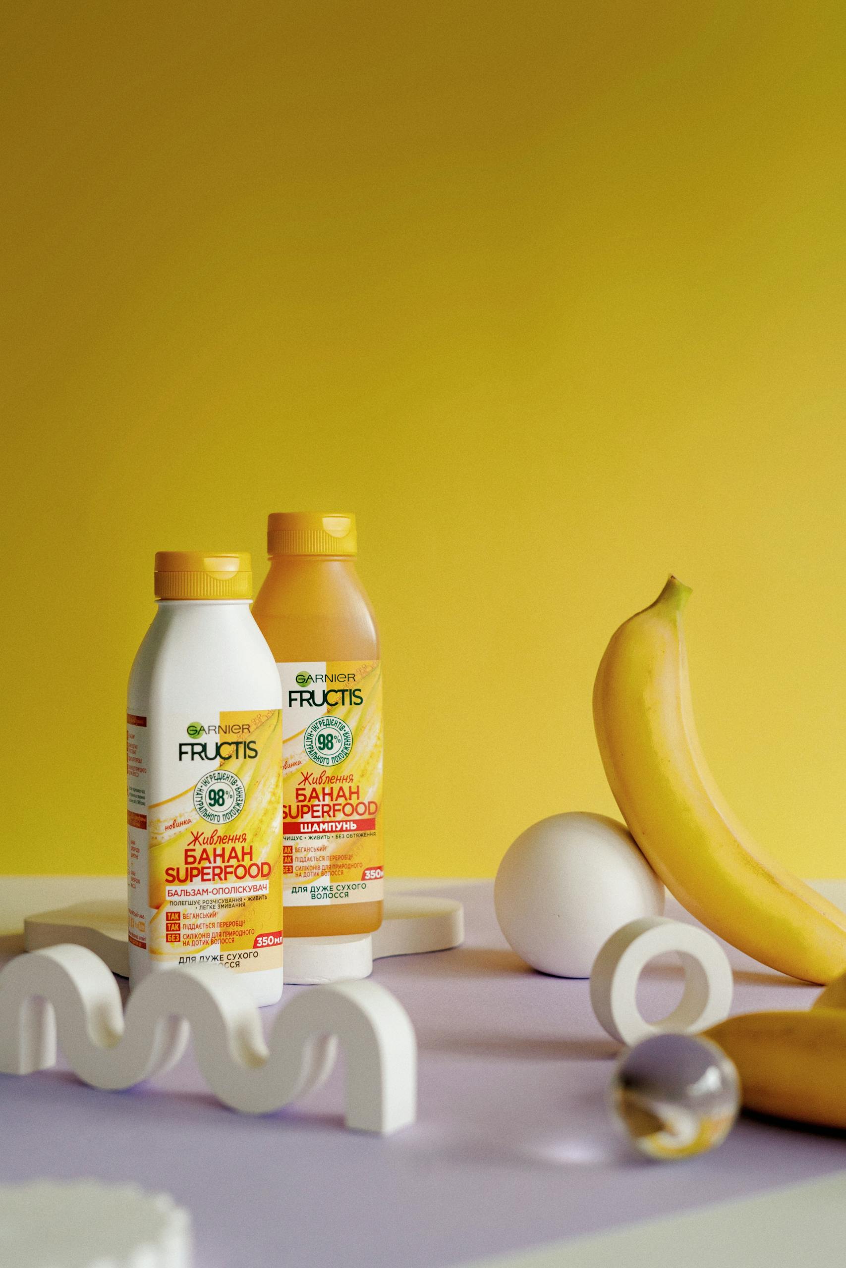 Vibrant product photography featuring Garnier Fructis Banana Hair Food.
